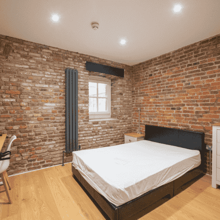 Modern house exterior with wood and stone elements, daytime